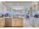 Spacious kitchen with island and breakfast bar, offering water views at 140 Riviera Dunes Way # 1001, Palmetto, FL 34221
