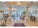 Spacious living room with water views and columns at 140 Riviera Dunes Way # 1001, Palmetto, FL 34221