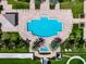 Relaxing resort-style pool with surrounding lounge chairs and landscaping at 140 Riviera Dunes Way # 1001, Palmetto, FL 34221