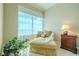 Sitting area with chaise lounge and natural light at 140 Riviera Dunes Way # 1001, Palmetto, FL 34221