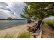Relaxing waterfront pathway with benches, offering scenic views at 140 Riviera Dunes Way # 1001, Palmetto, FL 34221