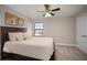 Bedroom featuring neutral walls, a window with a view, ceiling fan, and carpet at 14426 Woodland Spur Dr, Lithia, FL 33547