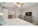 Main bedroom with king-size bed, dresser, and ceiling fan at 14426 Woodland Spur Dr, Lithia, FL 33547