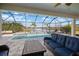 Relaxing screened pool and patio area, offering a spa and lake views at 14426 Woodland Spur Dr, Lithia, FL 33547