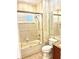 Bathroom with glass-enclosed tub/shower combo, single vanity, and tiled floors at 18007 Malakai Isle Dr, Tampa, FL 33647