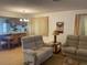 Living room with two sofas, a coffee table, and an adjacent dining area at 2165 Corbin Pl # A, Palm Harbor, FL 34683