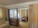 Living area with sliding glass doors, carpet, neutral walls, and natural light at 2165 Corbin Pl # A, Palm Harbor, FL 34683
