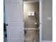 Clean and simple half-bathroom with gray tile floors at 21869 Adriatic Ln, Land O Lakes, FL 34637