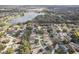 Aerial view of residential neighborhood with lake at 3022 Beaver Pond Trl, Valrico, FL 33596