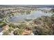 Community overview with lake and homes at 3022 Beaver Pond Trl, Valrico, FL 33596