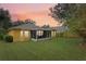 Spacious backyard with screened patio and lush lawn at 3022 Beaver Pond Trl, Valrico, FL 33596