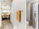 Updated bathroom with toilet and shower, view to main bedroom at 3022 Beaver Pond Trl, Valrico, FL 33596