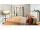 Bedroom with large window and comfortable bedding at 3022 Beaver Pond Trl, Valrico, FL 33596