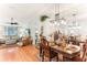 Elegant dining room with a large wooden table and chandelier at 3022 Beaver Pond Trl, Valrico, FL 33596