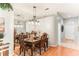 Bright dining room with hardwood floors and mirrored wall at 3022 Beaver Pond Trl, Valrico, FL 33596