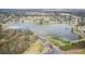 Aerial view of community entrance and lake at 3022 Beaver Pond Trl, Valrico, FL 33596