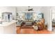 Spacious living room featuring hardwood floors and comfy seating at 3022 Beaver Pond Trl, Valrico, FL 33596