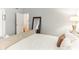 Bright bedroom with king bed and access to the bathroom at 3022 Beaver Pond Trl, Valrico, FL 33596