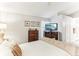 Spacious main bedroom with a king-size bed and built in TV stand at 3022 Beaver Pond Trl, Valrico, FL 33596