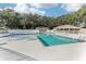 Community pool with lounge chairs at 3022 Beaver Pond Trl, Valrico, FL 33596
