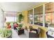 Relaxing screened porch with patio furniture and grill at 3022 Beaver Pond Trl, Valrico, FL 33596