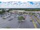 Aerial view of shopping center parking lot with various stores at 36522 Well Hill Way, Zephyrhills, FL 33541