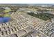 Aerial view of community and surrounding landscape at 36522 Well Hill Way, Zephyrhills, FL 33541