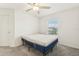 Cozy bedroom with a double bed and ceiling fan at 36522 Well Hill Way, Zephyrhills, FL 33541