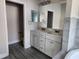 Primary bathroom featuring a double vanity with granite countertops and tiled flooring at 413 Shannon Estates Ct, Plant City, FL 33563