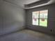 Unfinished bedroom featuring a modern window framing an outdoor view at 413 Shannon Estates Ct, Plant City, FL 33563