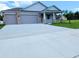 Charming single-story home featuring a spacious three-car garage and a welcoming covered entryway at 413 Shannon Estates Ct, Plant City, FL 33563