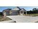 Charming new construction home featuring a three car garage and covered front porch at 413 Shannon Estates Ct, Plant City, FL 33563
