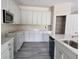Bright kitchen with stainless steel appliances, granite counters, and ample cabinet space at 413 Shannon Estates Ct, Plant City, FL 33563
