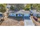 Aerial view showing a charming ranch home with a driveway at 4304 Woodfield Ave, Holiday, FL 34691