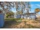 Spacious backyard with shed and mature oak tree at 4304 Woodfield Ave, Holiday, FL 34691