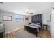 Cozy bedroom featuring a double bed, window, and ceiling fan at 4304 Woodfield Ave, Holiday, FL 34691