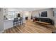 Modern kitchen with white cabinets, stainless steel appliances, and quartz countertops at 4304 Woodfield Ave, Holiday, FL 34691