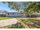 Spacious backyard with patio and large tree providing shade at 5239 22Nd N Ave, St Petersburg, FL 33710