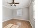 Spacious bedroom with wood floors and a window with blinds at 5239 22Nd N Ave, St Petersburg, FL 33710