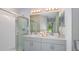 Elegant bathroom with dual sinks, a large shower, and modern fixtures at 5803 Laurelcrest Gln, Palmetto, FL 34221