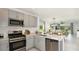 Modern kitchen open to dining and living areas at 5803 Laurelcrest Gln, Palmetto, FL 34221