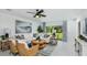 Spacious living room with a comfortable seating area and access to the backyard at 5803 Laurelcrest Gln, Palmetto, FL 34221