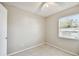 Cozy bedroom with tiled floors and ceiling fan at 7403 S Swoope St, Tampa, FL 33616