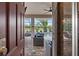 View of the pool area from interior French door at 803 Bella Verde Pl, Ruskin, FL 33573