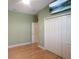 Bedroom with double closets and a view of the hallway at 8933 Crescent Forest Blvd, New Port Richey, FL 34654