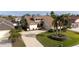 Two-story house with driveway and landscaping, aerial view at 107 17Th St, Belleair Beach, FL 33786