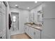 Updated bathroom with double vanity and granite countertops at 107 17Th St, Belleair Beach, FL 33786
