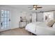 Spacious bedroom with sliding barn door and access to bathroom at 107 17Th St, Belleair Beach, FL 33786