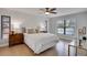 Bright bedroom with hardwood floors and a ceiling fan at 107 17Th St, Belleair Beach, FL 33786