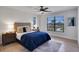 Bright bedroom with a comfy bed, large window, and wood floors at 107 17Th St, Belleair Beach, FL 33786